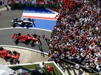 Машины Ferrari и Mercedes после финиша Гран При Великобритании