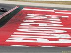 Фернандо Алонсо на трассе в Барселоне за рулём McLaren MP4-31